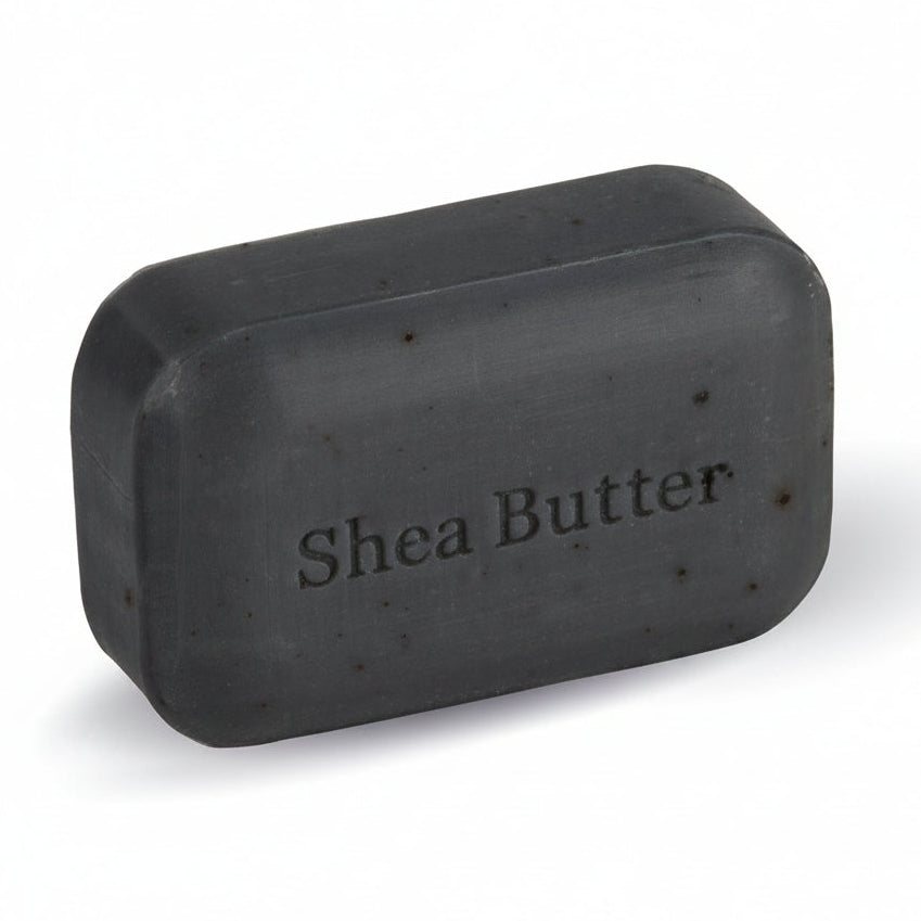 A rectangular bar of dark charcoal gray shea butter soap with rounded corners, featuring the text 'Shea Butter' embossed on the front, set against a plain white background.