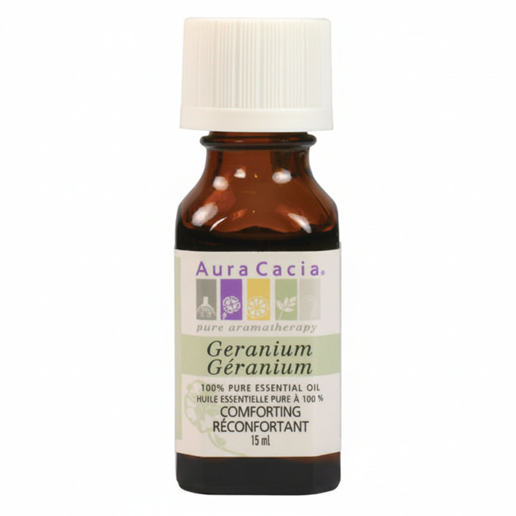 A 15 ml bottle of Aura Cacia Geranium Essential Oil on a plain white background. The bottle is amber glass with a white ribbed cap and a cream-colored label featuring purple and green text.